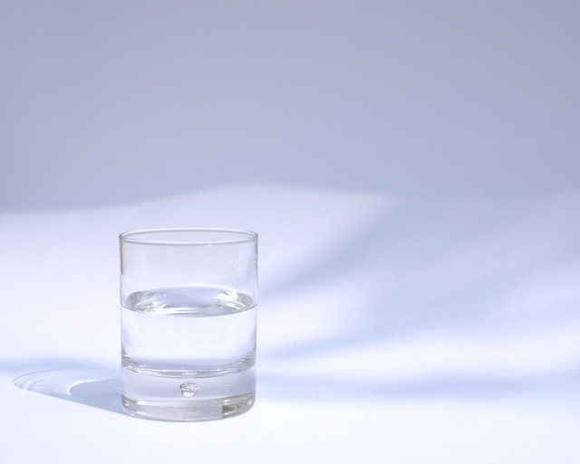 A refreshing image showing a glass of water with lemon and mint, symbolizing hydration.